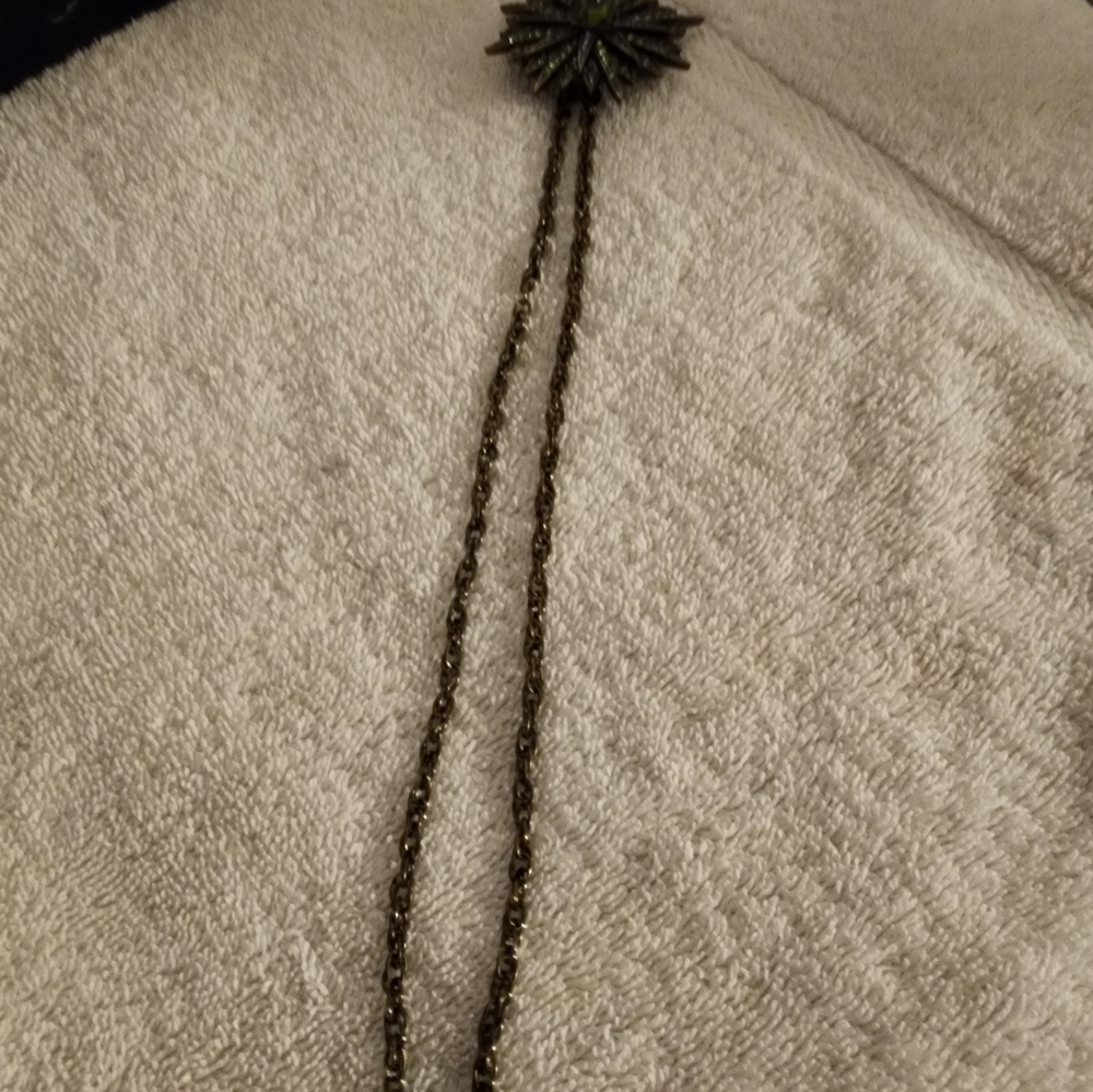 Antique Pin/necklace    Rhinstone Burst Pendant.